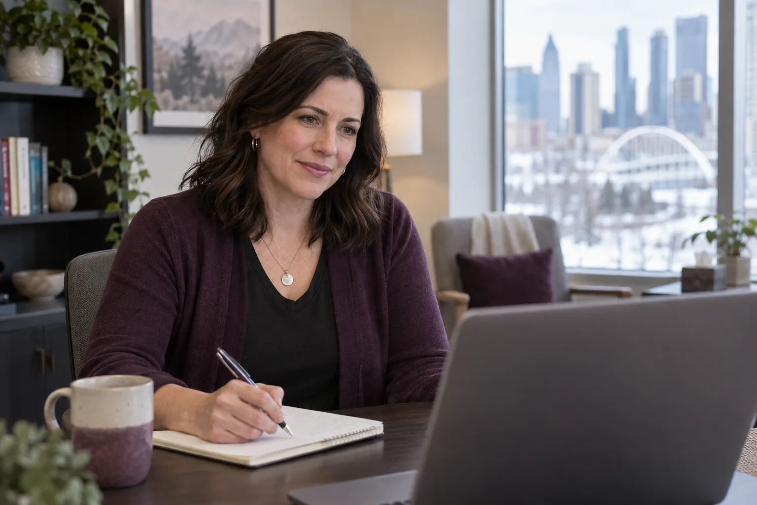 Mental-health provider listening during an online therapy assessment for an Edmonton patient